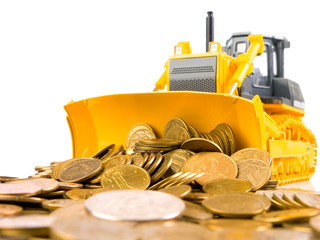 Yellow bulldozer raked pile of coins