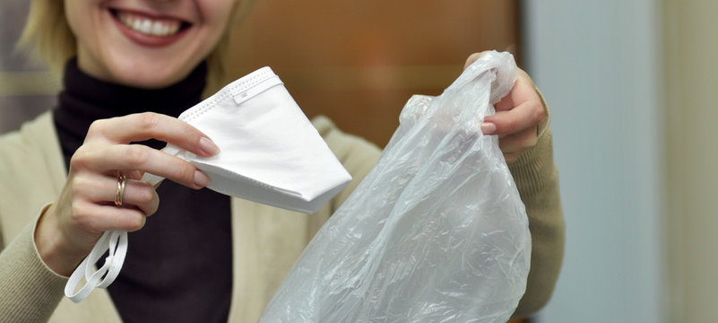 Woman Throwing Used Flu Mask