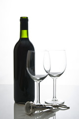 bottle of wine and wineglasses on white background