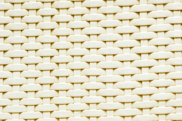 Background made of woven reddish plastic stripes