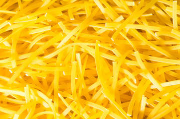 Extreme close up of yellow italian pasta