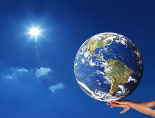 conceptual image of a big globe on hands