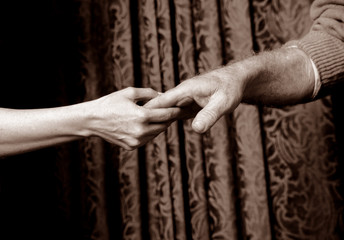 close up shot of hands holding each other