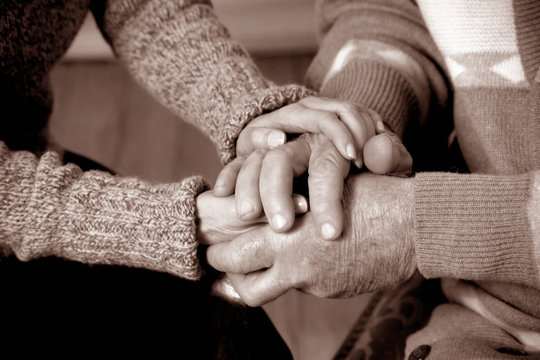 Close Up Shot Of Hands Holding Each Other