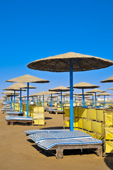 Straw umbrellas on the beach of Egypt