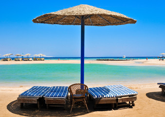 Straw umbrellas on the beach of Egypt