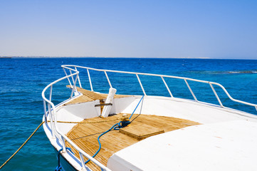 White yacht moored by the pier in the Red sea, Egypt