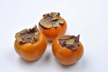 organic sharon fruit and a bright background