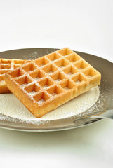 wafer with icing sugar on a plate