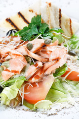 salad with grilled salmon fillet.