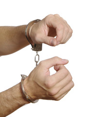 Hände in Handschellen