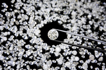 A Large Diamond In Tweezers