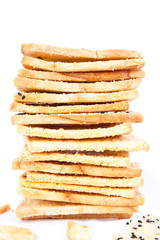 Stack of crunchy bread  with sesame on top