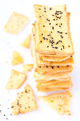 Stack of crunchy bread  with sesame on top
