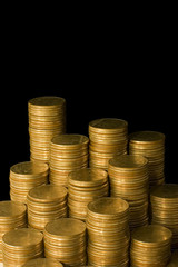 Golden coins isolated on black background