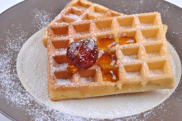 wafer with icing sugar and one cherry