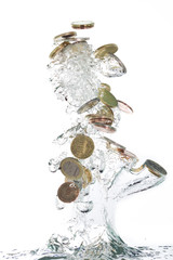 Euro coins jumping out of the clear water