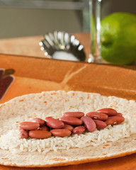 Red beans, rice, tortilla, lime - raw food closeup