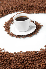Cup with coffee, costing on coffee grain