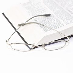 Close up of the book with glasses