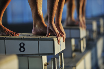 young swimmmer on swimming start