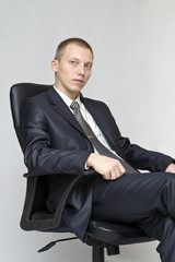 Businessman sitting in an office chair.