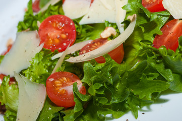 Tomatoes with cheese/ salad .