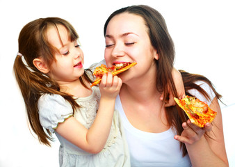 mother and daughter eating pizza