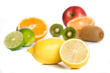 Naklejka na ściany i meble Lemon with other fruit isolated on white