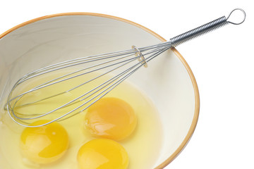 Eggs and whisk.