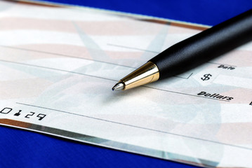 Write the dollar amount on the check isolated on blue