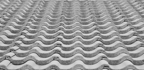 Black and white phot of a tile roof, ideal for a background