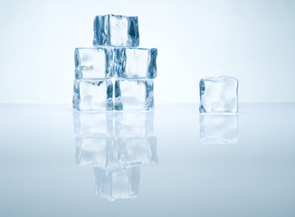 pile of ice cubes with reflection