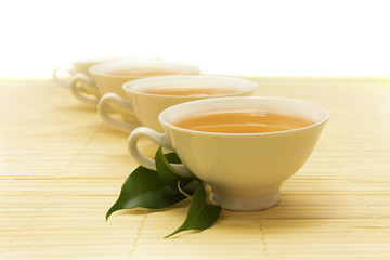 white cups of tea