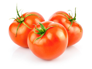 fresh red tomatoes with green leaf isolated