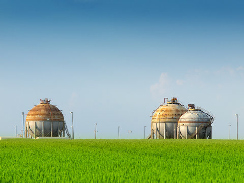 fuel tank in the refinery and wheat field