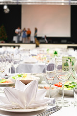 Details of a wedding banquet with stage and artists on it