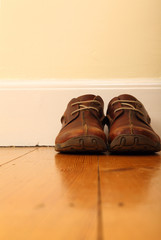 Pair of Leather Shoes on Wooden Floor