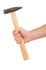 Hand holds hammer
