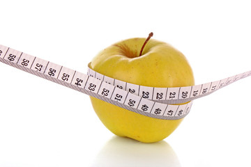 Apple and a measure tape, diet concept