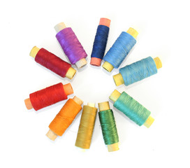 reels of color threads on white