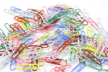 metal paperclips on white background