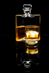 carafe of scotch whiskey or bourbon and drink with ice