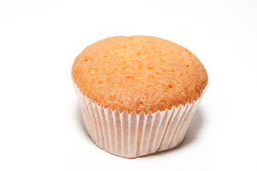 Sweet round muffin in confectionery paper