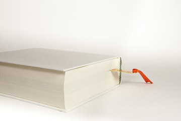 white book with a bookmark