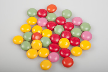 colored candies on a light background