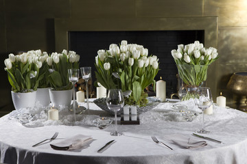 Decoration of the dining table for Valentine's Day. White tulip.