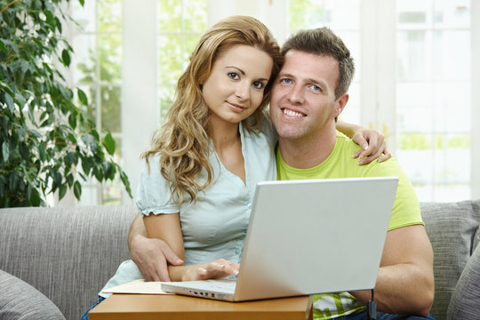 Couple using laptop computer