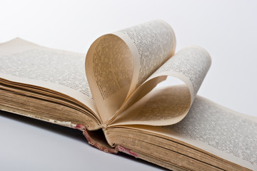 Pages of a book folded in to a heart shape