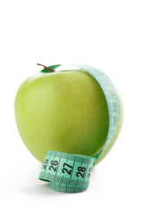 green apple with measuring tape